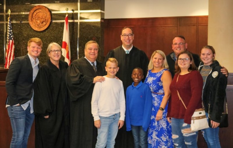 Ronnie Oneal IV with the Blair family and judges of the 13th Judicial Circuit Court of Florida