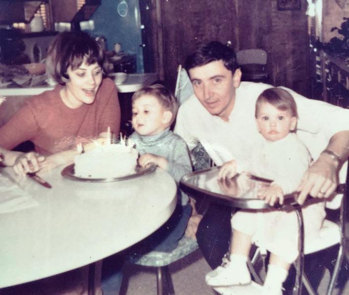 Childhood photo of Jillian Fink with her parents and sister
