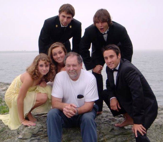 Matthew Rutler with his father, David Rutler, and siblings