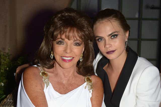Cara with her godmother Dame Joan Collins