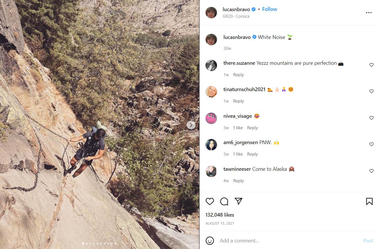 Lucas Bravo posts an Instagram photo of himself rock climbing and trekking
