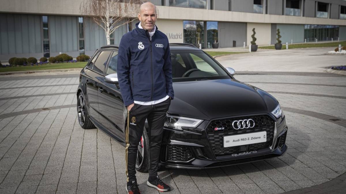 Zidane standing near an Audi