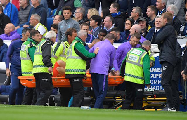 Hugo Lloris being carried on a stretcher after his injury