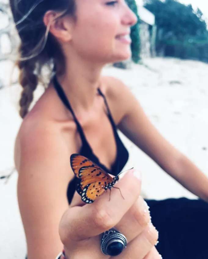 Aurélie Pons holding a butterfly