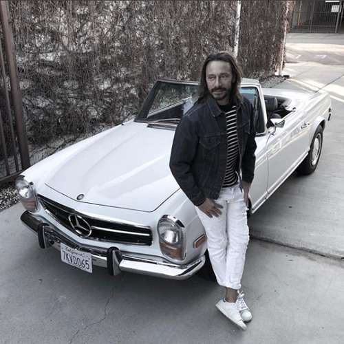 Bon Sinclar in his vintage 1969 Mercedes