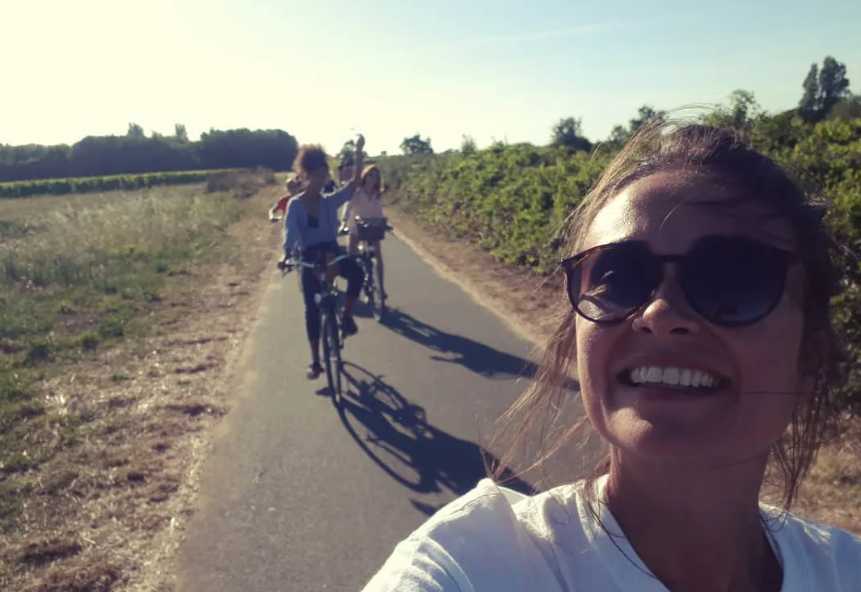 Julie Hammett rides a bike with her friends